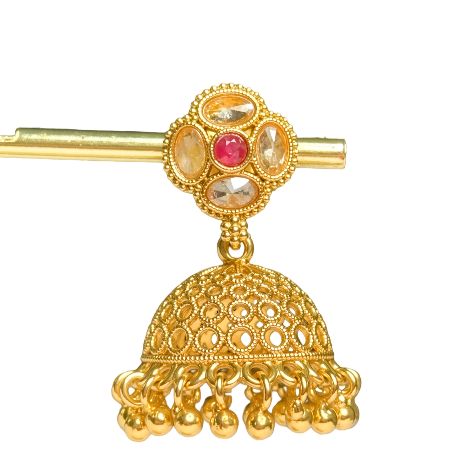 Gold jhumka earring with a red gemstone on a white background